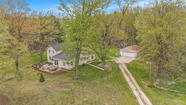 drone / aerial view featuring a wooded view