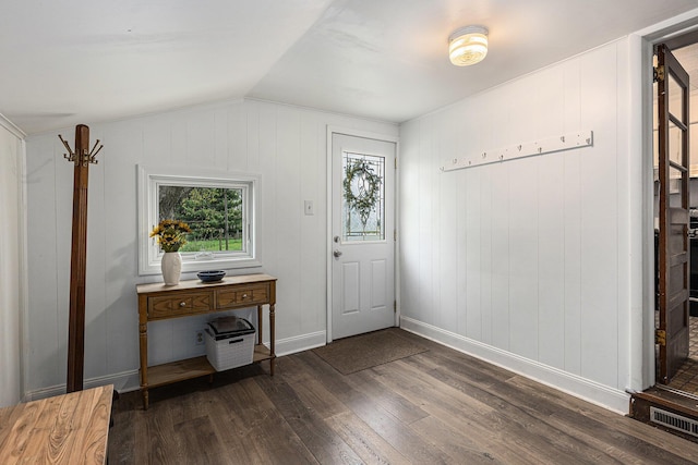 entrance foyer featuring baseboards, vaulted ceiling, dark wood finished floors, and visible vents