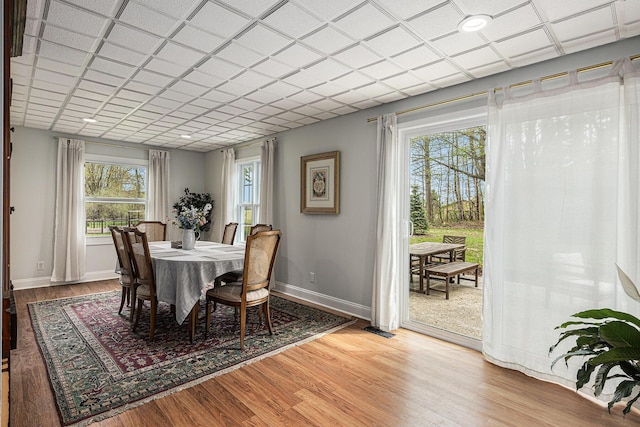 dining room featuring baseboards, visible vents, and light wood-style flooring