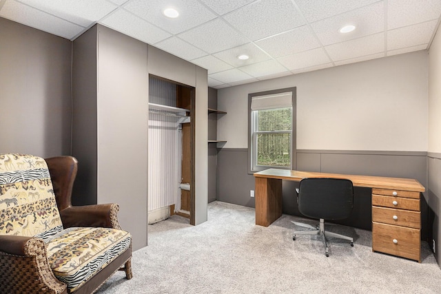 carpeted office space with recessed lighting, wainscoting, and a drop ceiling