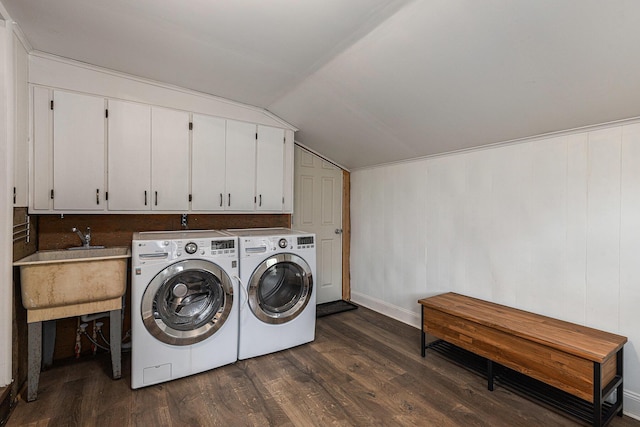 clothes washing area with dark wood-type flooring, cabinet space, independent washer and dryer, and baseboards