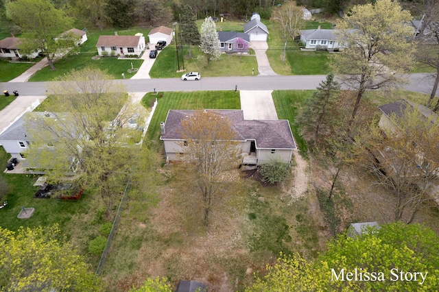 birds eye view of property with a residential view