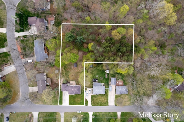 birds eye view of property with a residential view