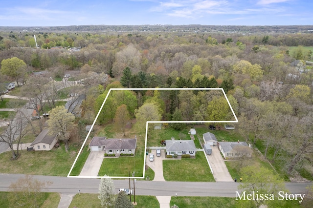 aerial view featuring a view of trees
