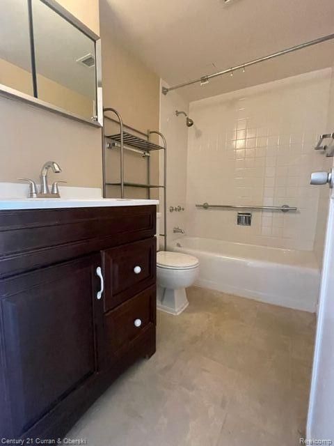 bathroom featuring vanity, tub / shower combination, visible vents, and toilet