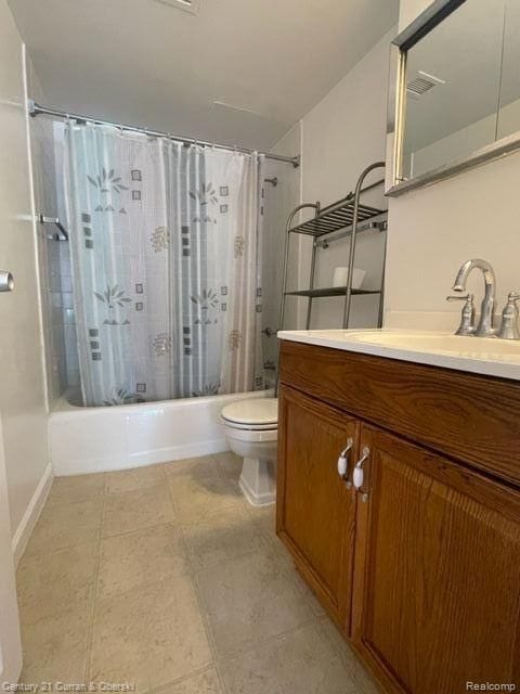 full bath featuring vanity, shower / bathtub combination with curtain, and toilet