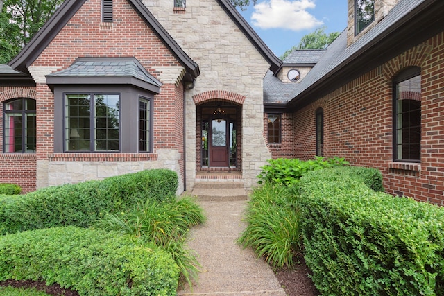 11599 Erins Way, Romeo, MI 48065 - property entrance featuring stone siding and a high end roof