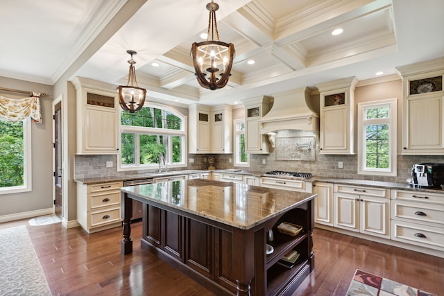 11599 Erins Way, Romeo, MI 48065 - kitchen with a chandelier, premium range hood, open shelves, stainless steel appliances, and healthy amount of natural light