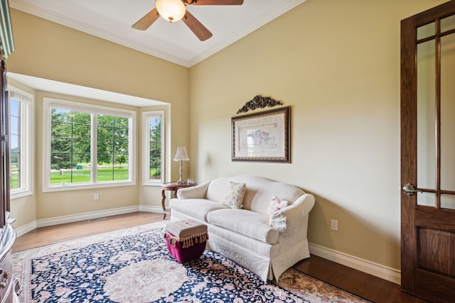 11599 Erins Way, Romeo, MI 48065 - sitting room featuring ceiling fan, wood finished floors, crown molding, and baseboards