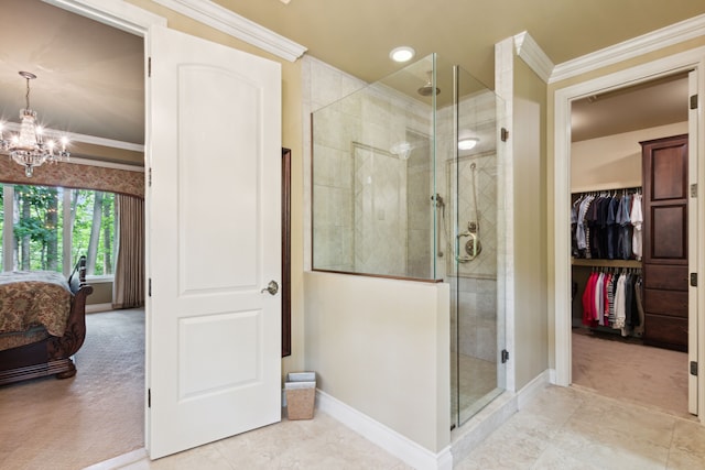 11599 Erins Way, Romeo, MI 48065 - ensuite bathroom featuring baseboards, a chandelier, a shower stall, crown molding, and a walk in closet