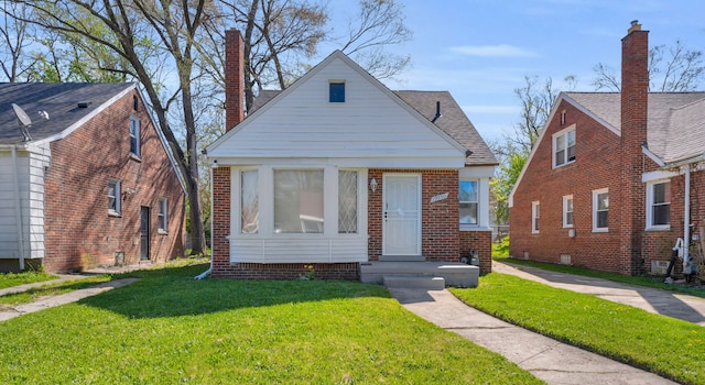 19950 Gilchrist St, Detroit, MI 48235 - bungalow featuring brick siding, a chimney, and a front lawn