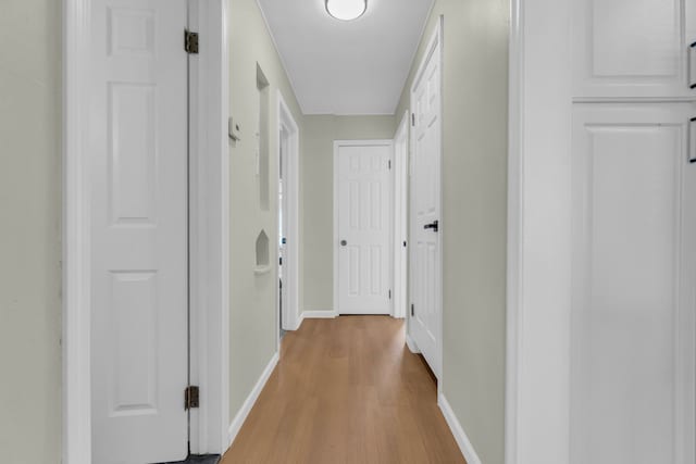 19950 Gilchrist St, Detroit, MI 48235 - hallway featuring baseboards and light wood finished floors