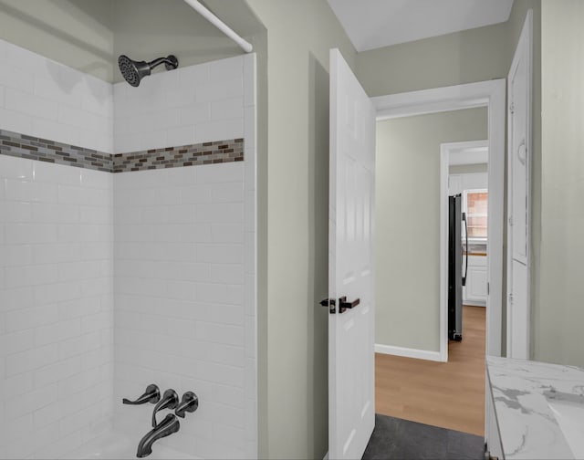 19950 Gilchrist St, Detroit, MI 48235 - full bathroom with baseboards and wood finished floors