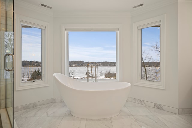 5820 Lakeview Ave, Orchard Lake, MI 48323 - bathroom with visible vents, marble finish floor, a freestanding bath, and baseboards