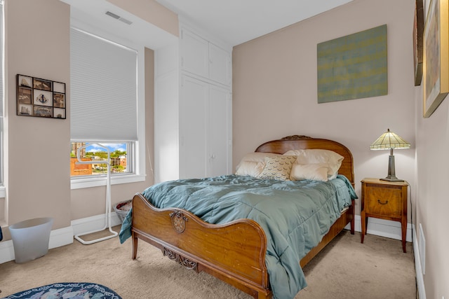 bedroom with carpet flooring and baseboards