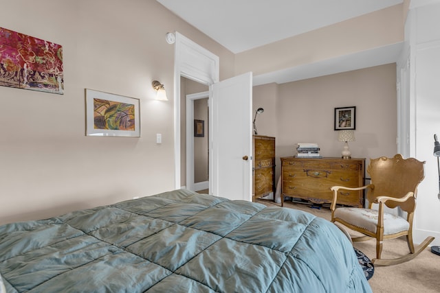 carpeted bedroom featuring baseboards