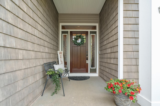 property entrance featuring covered porch