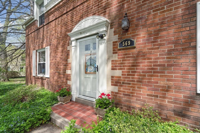 entrance to property with brick siding
