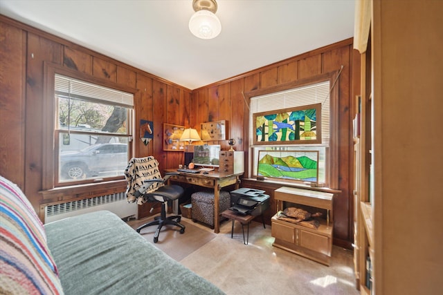 office space featuring wood walls and radiator heating unit