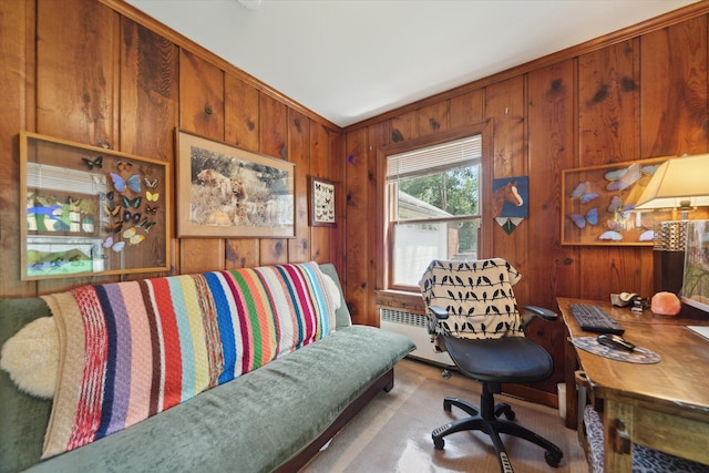 office featuring wooden walls, carpet, and radiator