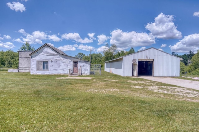 exterior space featuring a yard and concrete driveway