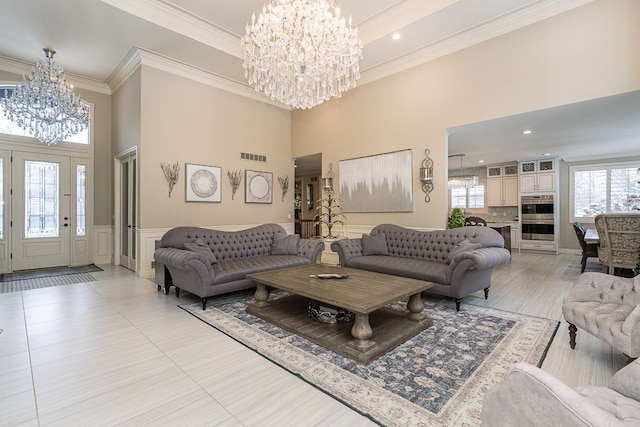3960 Harvest Creek Ct, Rochester, MI 48306 - living room with an inviting chandelier, crown molding, a high ceiling, and visible vents