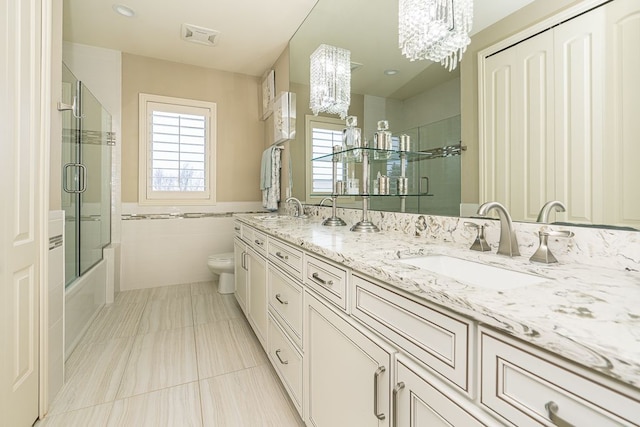 3960 Harvest Creek Ct, Rochester, MI 48306 - full bathroom with a sink, tile walls, toilet, and a chandelier