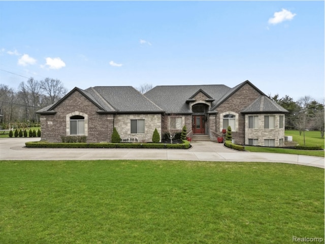 3960 Harvest Creek Ct, Rochester, MI 48306 - french country inspired facade with a shingled roof, stone siding, brick siding, and a front yard