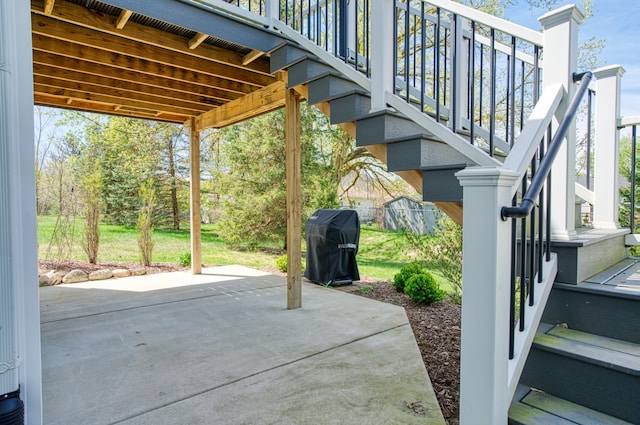 view of patio / terrace with stairs and grilling area
