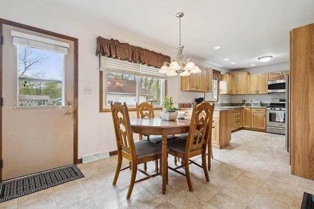 dining space with visible vents, baseboards, recessed lighting, a chandelier, and light tile patterned floors