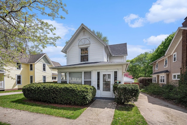 view of front of house with a shingled roof