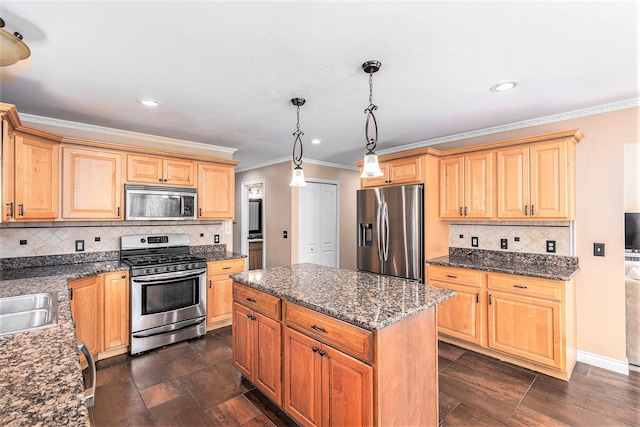 kitchen with a kitchen island, backsplash, crown molding, appliances with stainless steel finishes, and recessed lighting