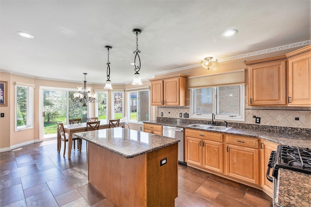 kitchen with decorative backsplash, a center island, dishwasher, a sink, and range with gas stovetop