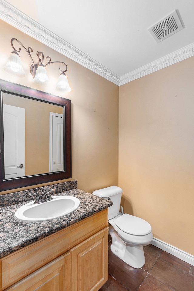 bathroom with visible vents, baseboards, toilet, and vanity