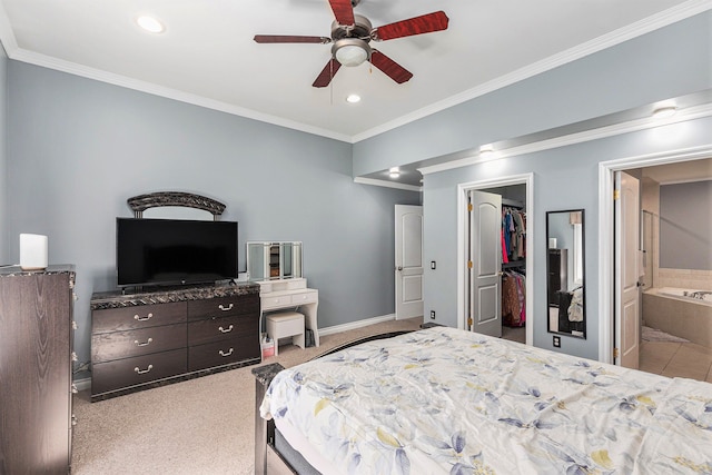 bedroom featuring a walk in closet, recessed lighting, baseboards, ornamental molding, and a closet