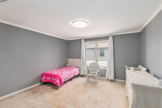 bedroom with light colored carpet, ornamental molding, and baseboards