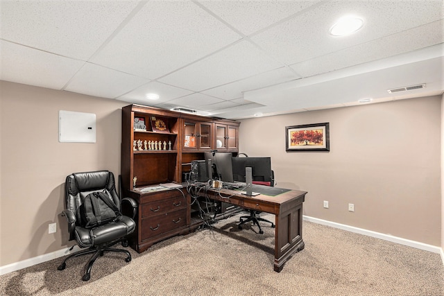 office area with baseboards, light carpet, and visible vents