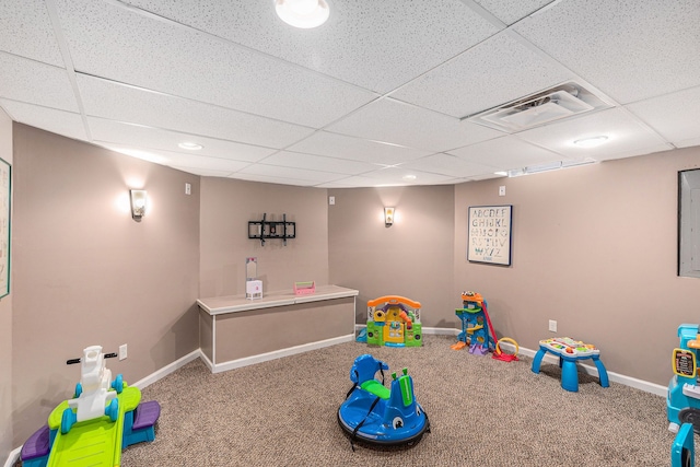 rec room with visible vents, carpet flooring, a paneled ceiling, and baseboards