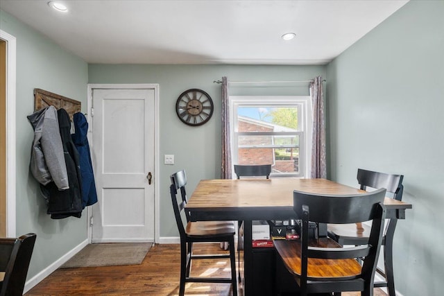 dining room with recessed lighting, baseboards, and dark wood finished floors