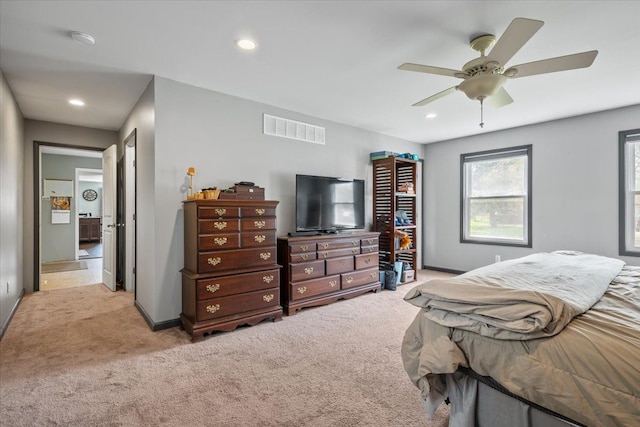 bedroom featuring visible vents, recessed lighting, baseboards, and light carpet