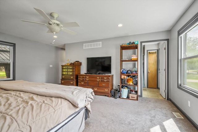 carpeted bedroom with ceiling fan, recessed lighting, and visible vents