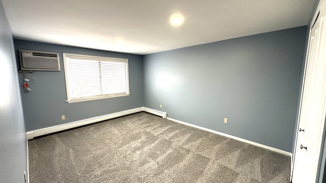 carpeted spare room with baseboards, baseboard heating, and an AC wall unit