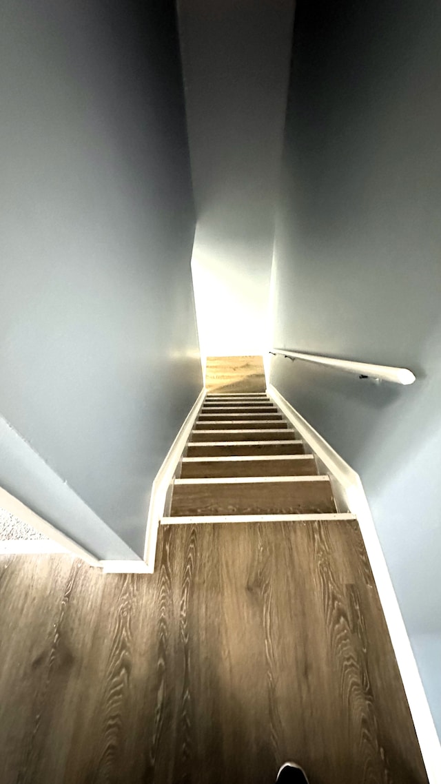 stairs with wood finished floors