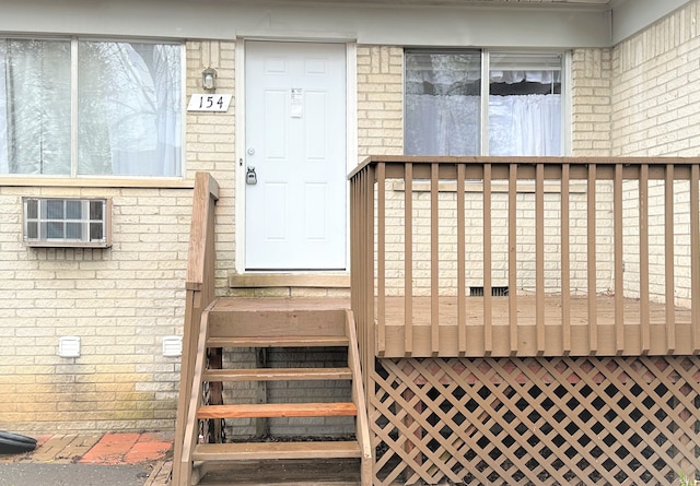 doorway to property featuring a deck