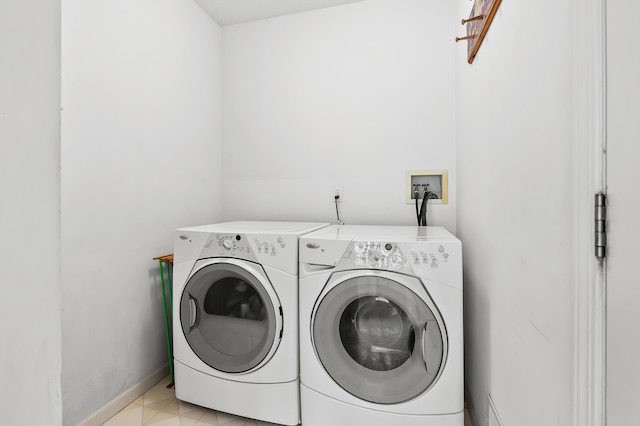 2796 Eagle Harbor Ave, Portage, MI 49024 - clothes washing area with laundry area, washing machine and dryer, and baseboards