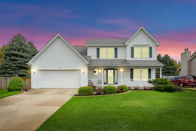 2796 Eagle Harbor Ave, Portage, MI 49024 - traditional-style home featuring fence, an attached garage, a front lawn, a porch, and driveway