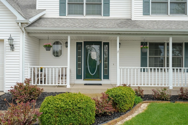 2796 Eagle Harbor Ave, Portage, MI 49024 - view of exterior entry with covered porch and a shingled roof