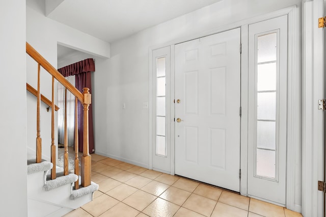 2796 Eagle Harbor Ave, Portage, MI 49024 - foyer entrance featuring light tile patterned floors and stairs
