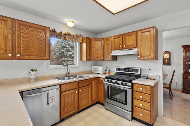 2796 Eagle Harbor Ave, Portage, MI 49024 - kitchen featuring a sink, appliances with stainless steel finishes, under cabinet range hood, and light countertops