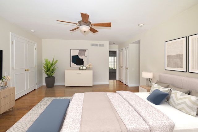 32824 Outland Trl, Bingham Farms, MI 48025 - bedroom featuring baseboards, a ceiling fan, wood finished floors, and visible vents
